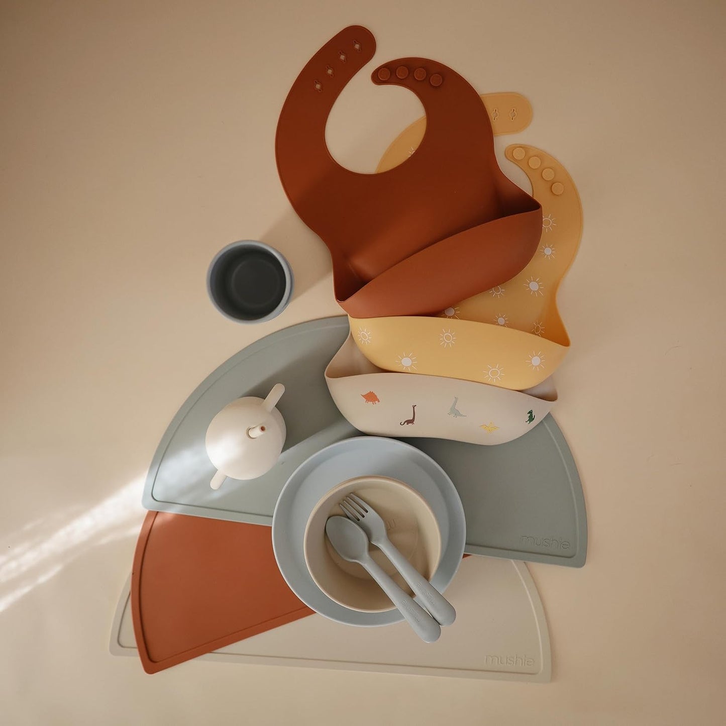 mushie Silicone Baby Bib | Adjustable Fit Waterproof Bibs (Clay)