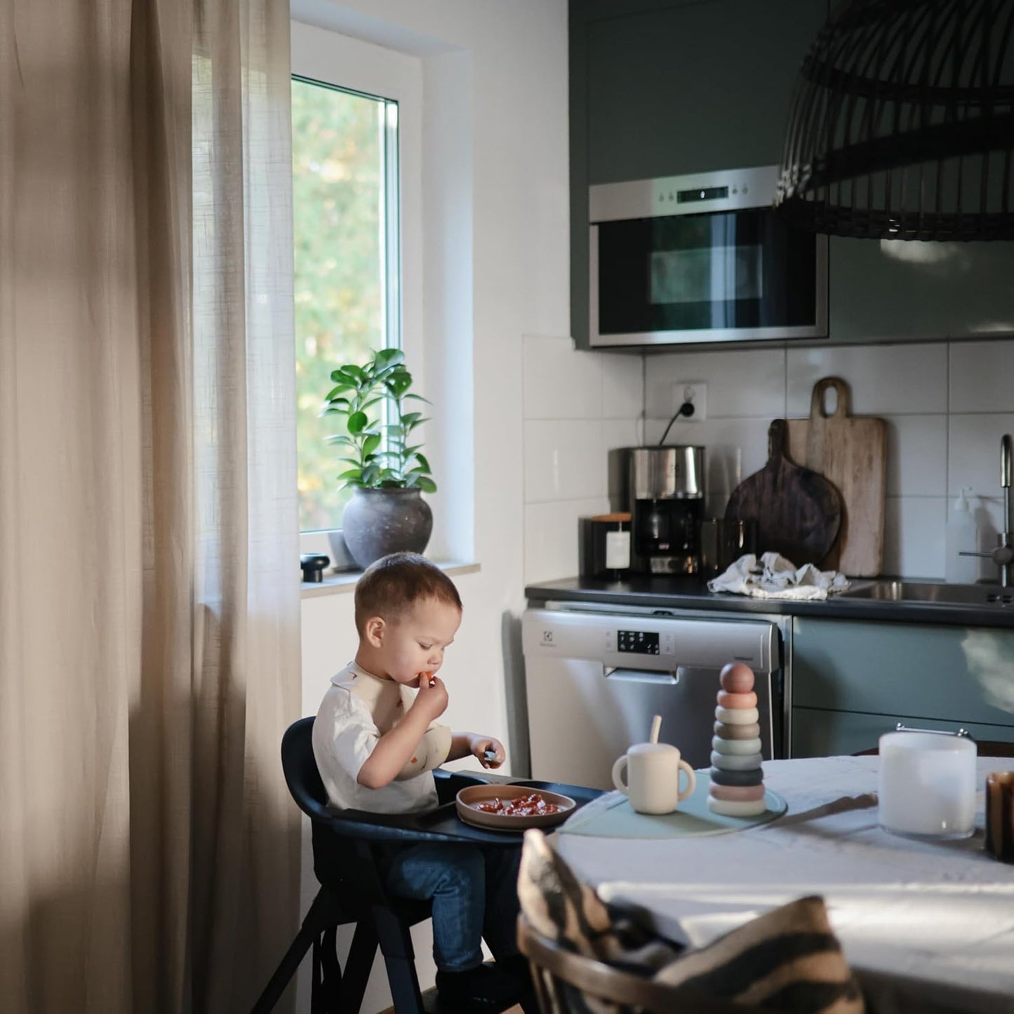 mushie Silicone Baby Bib | Adjustable Fit Waterproof Bibs (Pretzel)